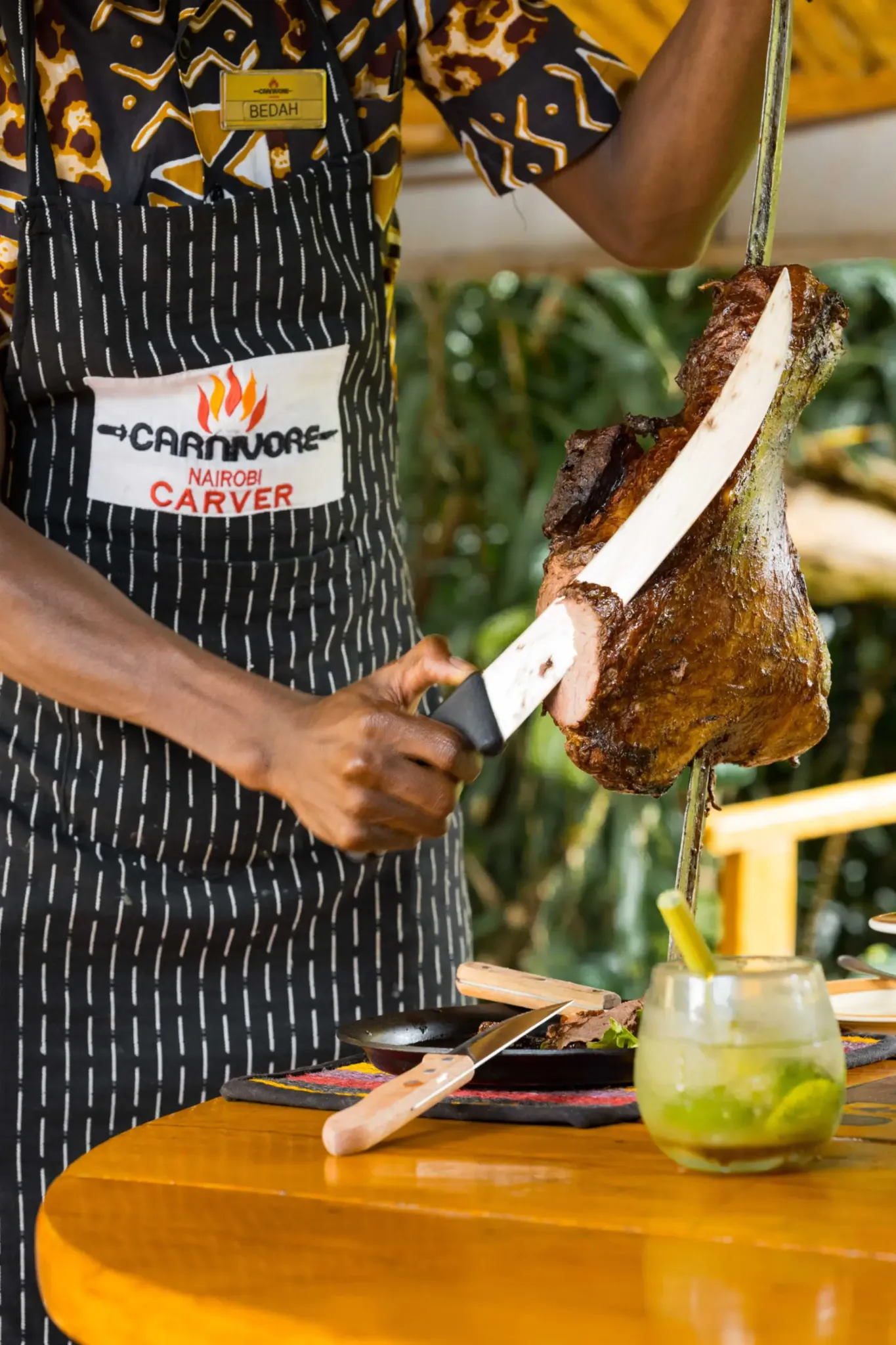 Carnivore carver cutting roast meat