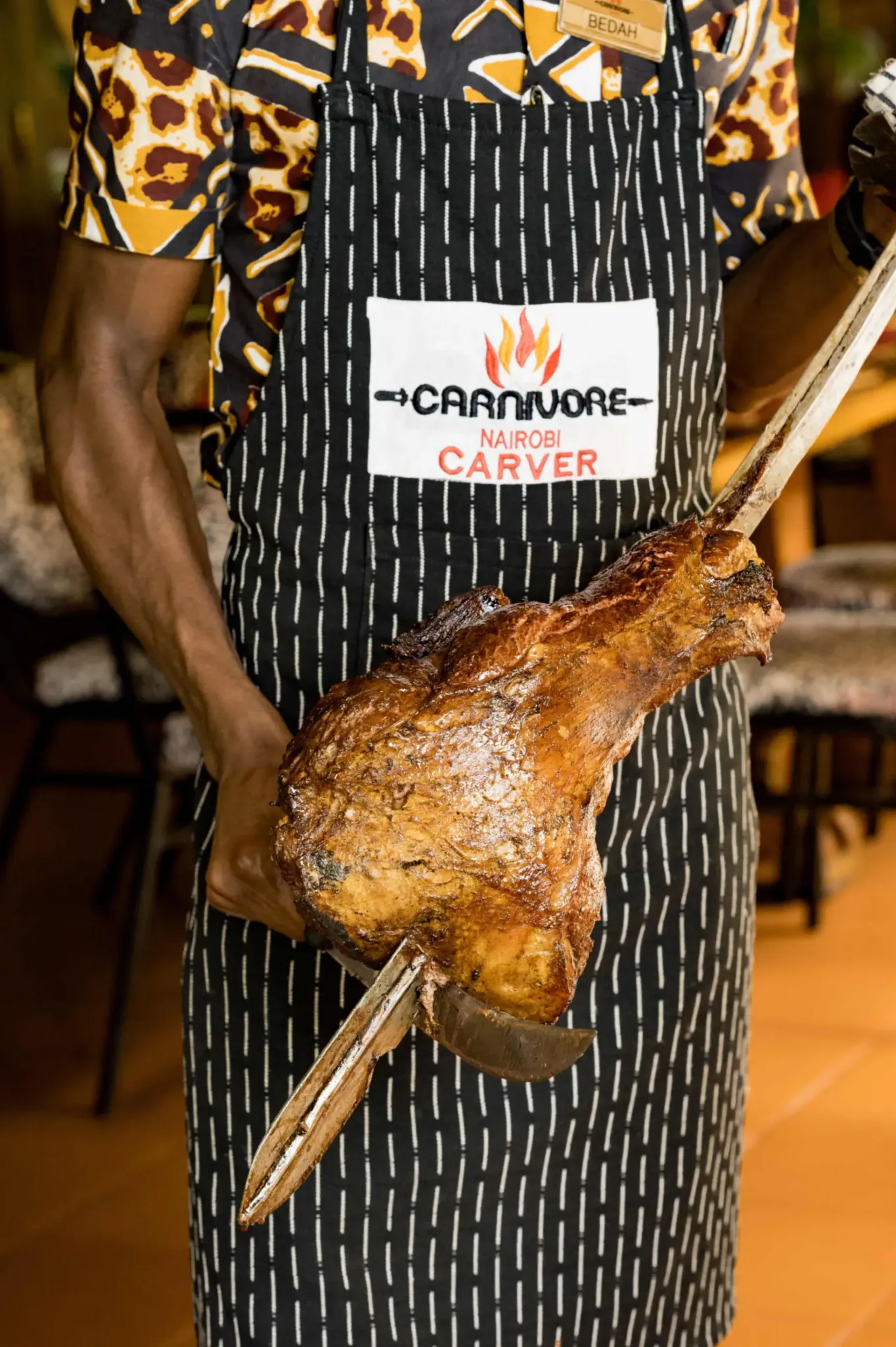 Carnivore whole roast presented by a carver